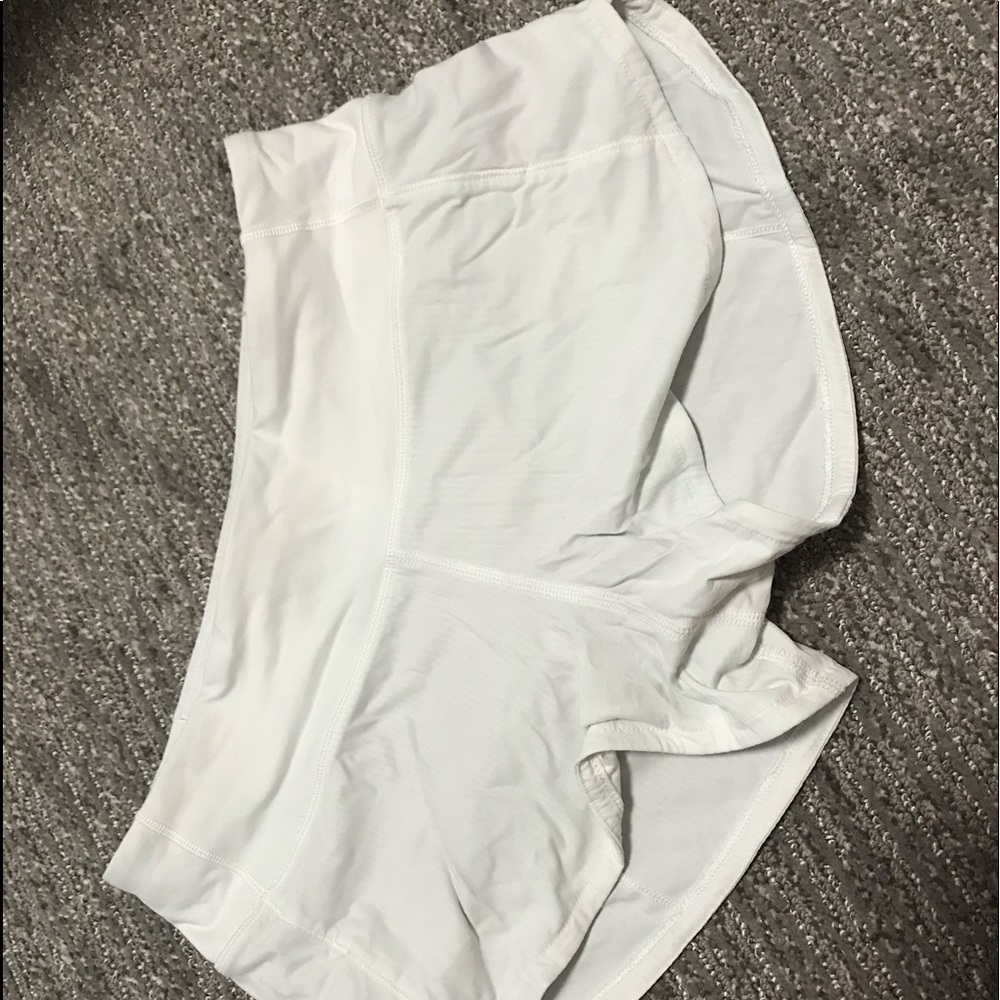 WHITE LULULEMON SHORTS. Speed up size 2 and 2.5”